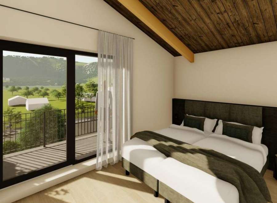 Experience tranquility in this stunning bedroom with a breathtaking view.