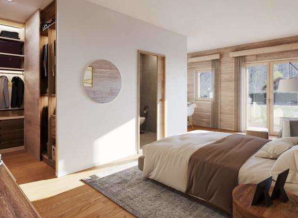 Experience luxury in this stunning bedroom featuring a spacious walk-in closet and a private ensuite bathroom.