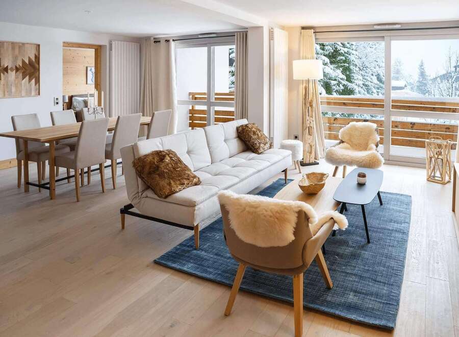 This stunning apartment boasts a spacious open-plan living area with floor-to-ceiling windows offering breathtaking views.