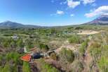This stunning property boasts breathtaking views of majestic mountains and lush greenery.
