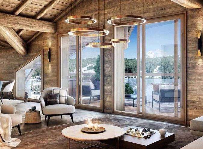 Experience luxury living in this stunning chalet, featuring a cozy interior with wooden accents and a breathtaking mountain view.