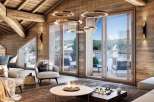 Experience luxury living in this stunning chalet, featuring a cozy interior with wooden accents and a breathtaking mountain view.
