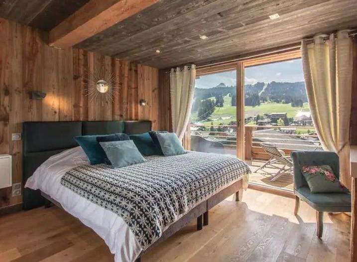 Experience the ultimate mountain retreat in this stunning bedroom.