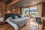 Experience the ultimate mountain retreat in this stunning bedroom.