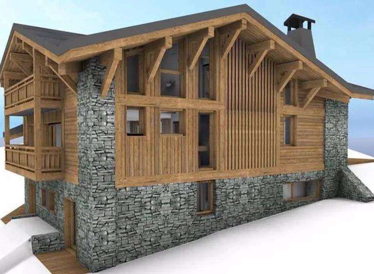 Discover the charm of this stunning mountain chalet, featuring a beautiful stone facade and warm wooden accents.