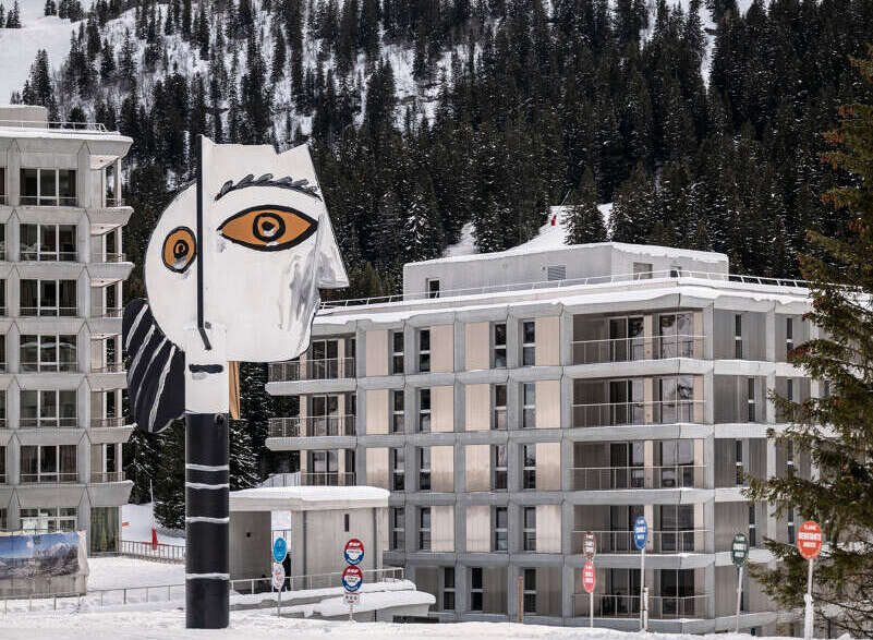 Discover a stunning property nestled in a winter wonderland, offering breathtaking views of snow-capped mountains and lush evergreen forests.
