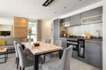 This modern kitchen and dining area is perfect for entertaining.