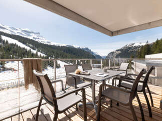 Enjoy breathtaking mountain views from this stunning balcony.