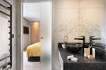 Step into luxury with this stunning bathroom, seamlessly connected to a stylish bedroom.