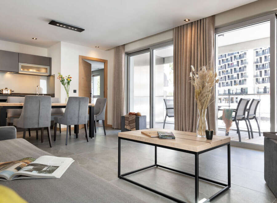 Discover modern living in this stylish apartment, featuring a bright and airy open-plan design.