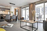 Discover modern living in this stylish apartment, featuring a bright and airy open-plan design.