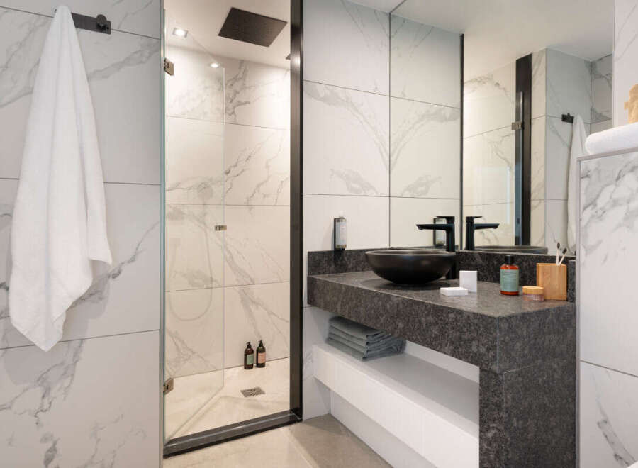 Step into a modern oasis with this stunning bathroom design.