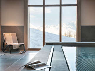 Relax and rejuvenate in our luxurious spa, featuring an indoor pool with stunning mountain views.