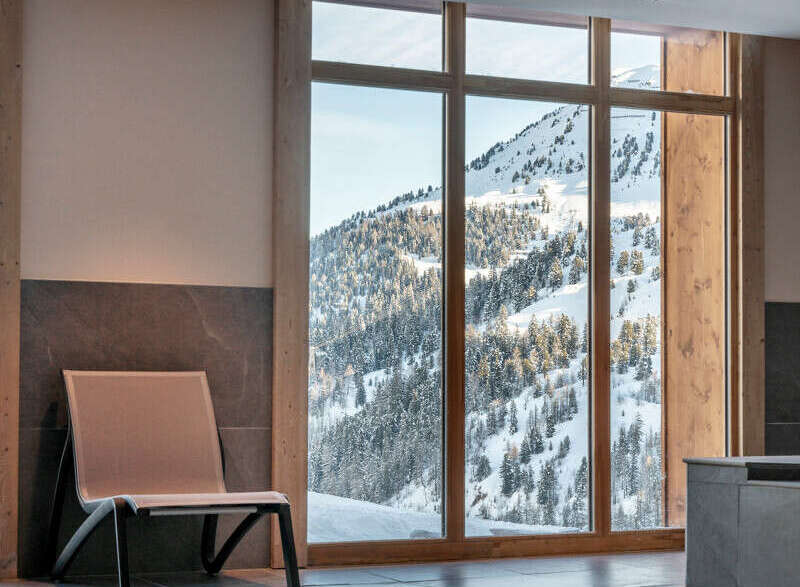 Indulge in the ultimate relaxation experience at our luxurious hotel, boasting a stunning indoor pool with breathtaking mountain views.