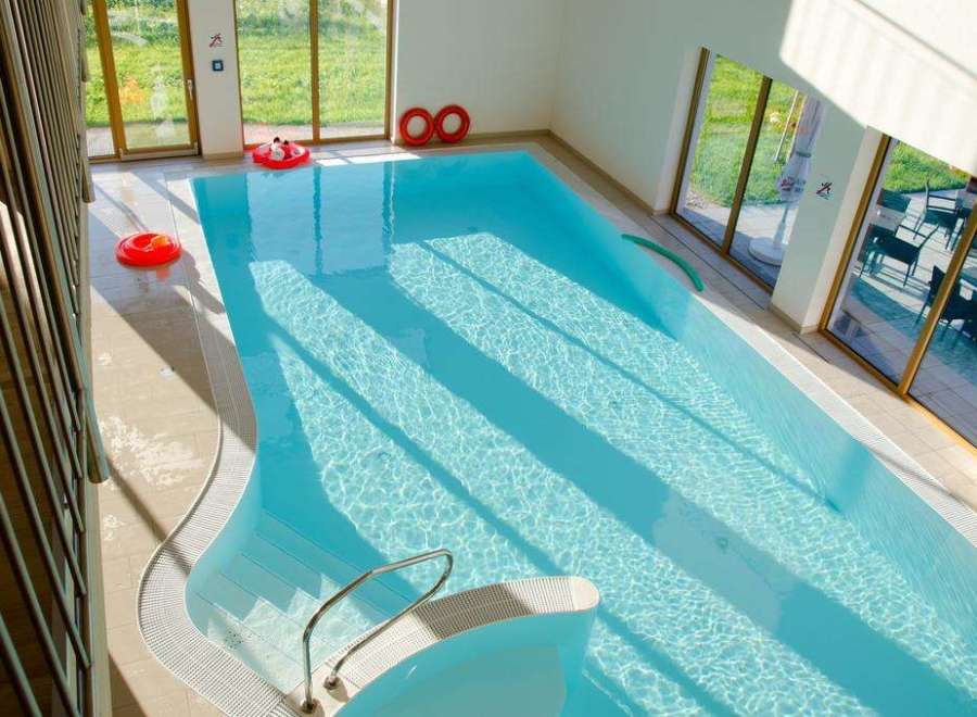 Enjoy a refreshing dip in the indoor pool, perfect for year-round enjoyment.