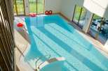 Enjoy a refreshing dip in the indoor pool, perfect for year-round enjoyment.