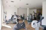 Step into a state-of-the-art fitness center, fully equipped to meet all your workout needs.