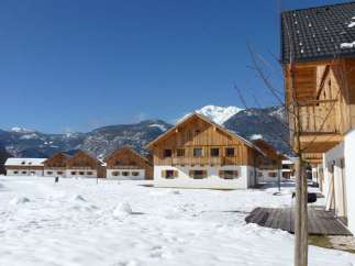 Experience the charm of alpine living in these cozy wooden chalets.