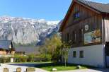 Nestled in a picturesque mountain setting, this charming property boasts a rustic wooden facade and a welcoming restaurant and bar.