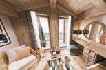 Experience the charm of this cozy cabin interior, featuring a warm wooden aesthetic and inviting atmosphere.