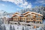 Luxury chalet-style apartments nestled in a snowy mountain setting.