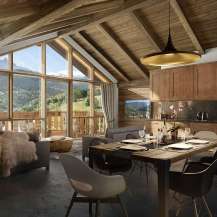 This stunning chalet boasts a spacious open-plan living area with floor-to-ceiling windows offering breathtaking mountain views.