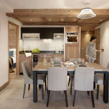 This stunning apartment boasts a spacious open-plan living area with a modern kitchen and dining space, perfect for entertaining guests.
