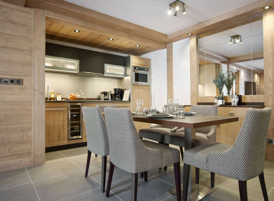 This stunning apartment boasts a spacious open-plan kitchen and dining area, perfect for entertaining guests or enjoying a quiet meal.