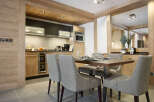 This stunning apartment boasts a spacious open-plan kitchen and dining area, perfect for entertaining guests or enjoying a quiet meal.