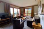 Enjoy stunning mountain views from this cozy living room.
