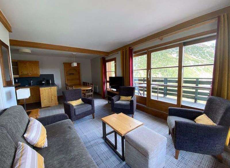 Discover a cozy living space with a comfortable sofa and armchairs, perfect for relaxation.