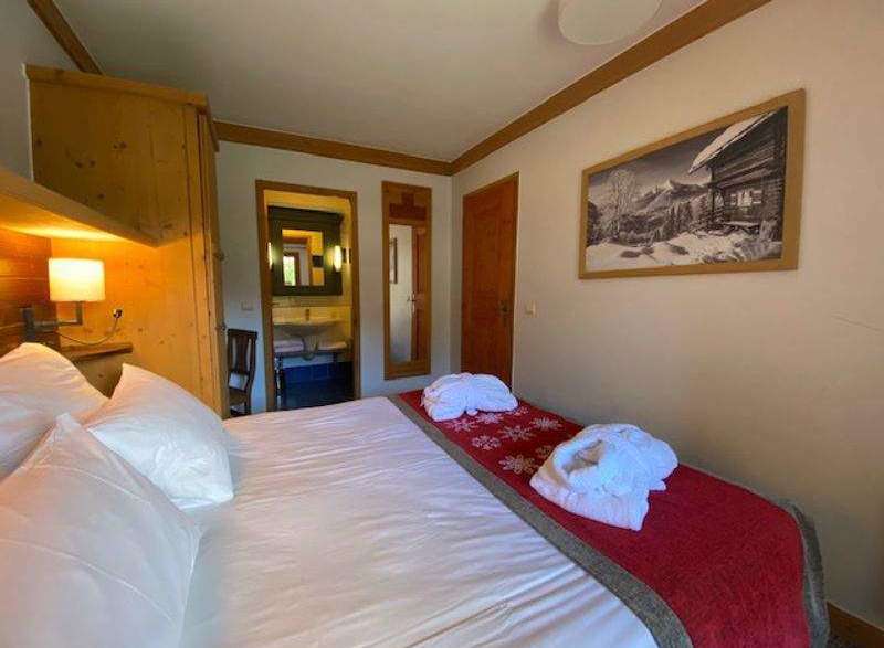 Cozy bedroom with a comfortable bed and soft pillows.