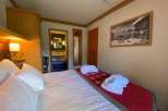Cozy bedroom with a comfortable bed and soft pillows.