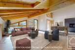 Discover the epitome of modern living in this stunning property, featuring a spacious open-plan design and high ceilings with exposed wooden beams.