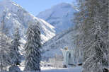 Experience the serenity of winter in this breathtaking mountain landscape.