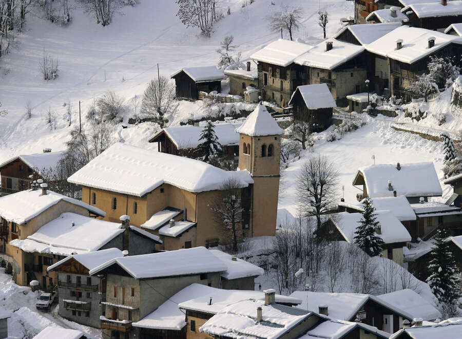 Nestled in a picturesque winter wonderland, this charming village offers a unique blend of rustic architecture and serene landscapes.