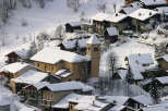 Nestled in a picturesque winter wonderland, this charming village offers a unique blend of rustic architecture and serene landscapes.
