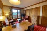 This charming property boasts a cozy living space with a warm, inviting atmosphere.