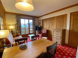 This charming property boasts a cozy living space with a warm, inviting atmosphere.