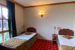 Cozy bedroom with two twin beds, perfect for a comfortable stay.