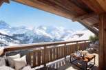 Experience the ultimate alpine escape with breathtaking mountain views from this luxurious chalet.