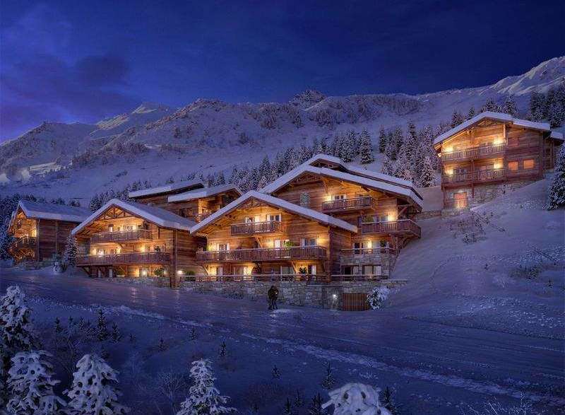 Experience the ultimate winter getaway in these stunning wooden chalets nestled in the snowy mountains.