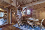 This charming wooden cabin kitchen offers a cozy and inviting atmosphere.