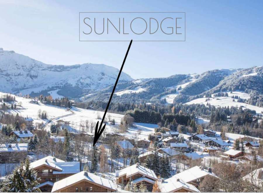Sunlodge: A luxurious chalet nestled in the heart of a snow-covered alpine village.