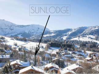 Sunlodge: A luxurious chalet nestled in the heart of a snow-covered alpine village.