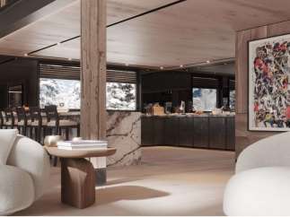 This luxurious chalet boasts a stunning open-plan living area with floor-to-ceiling windows offering breathtaking mountain views.