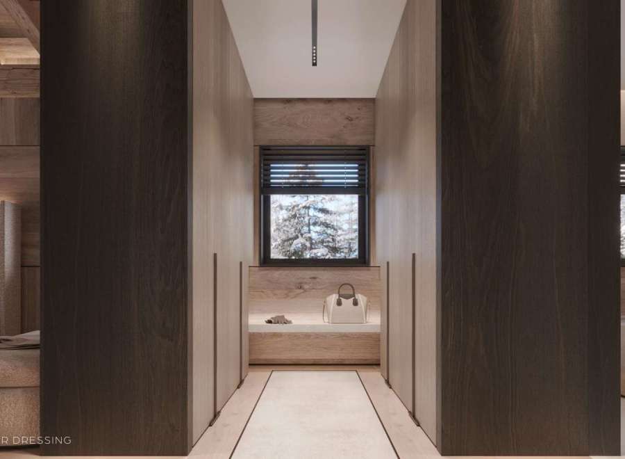 This luxurious master dressing boasts a spacious layout with ample built-in storage, highlighted by rich dark wood finishes and a calming neutral color palette.