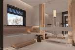 Luxurious master bathroom boasts a freestanding soaking tub, sleek floating vanity, and stunning mountain views.