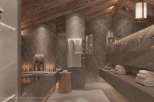 Luxurious VIP bathroom with stunning marble finishes and wooden accents.