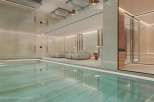Indulge in luxury with this stunning indoor swimming pool and spa.